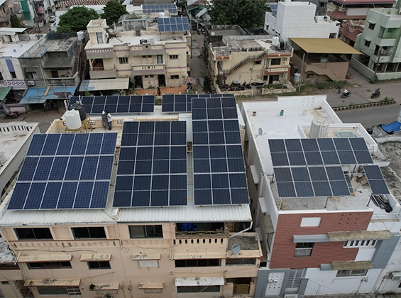 A residential building in Bharuch, Gujarat, showcasing a modern rooftop solar installation, reflecting the city's adoption of clean energy solutions by a premier solar company.